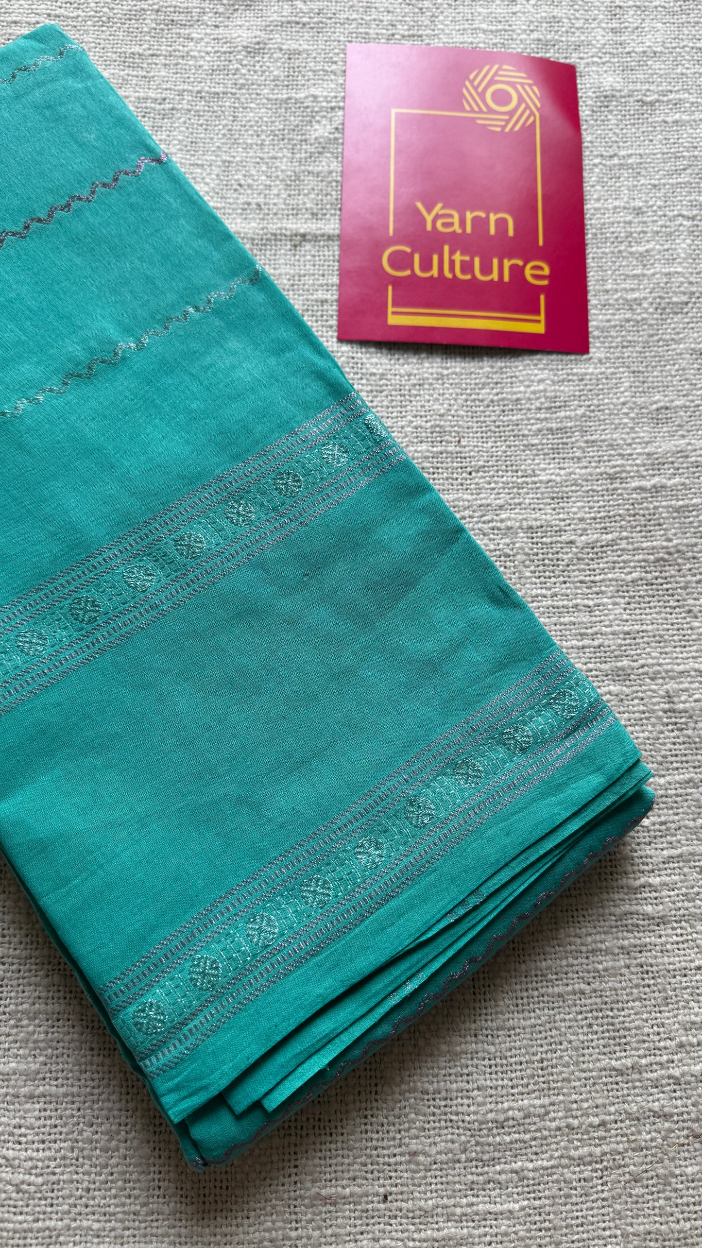 Turquoise veldhaari and patterned silver zari sungudi