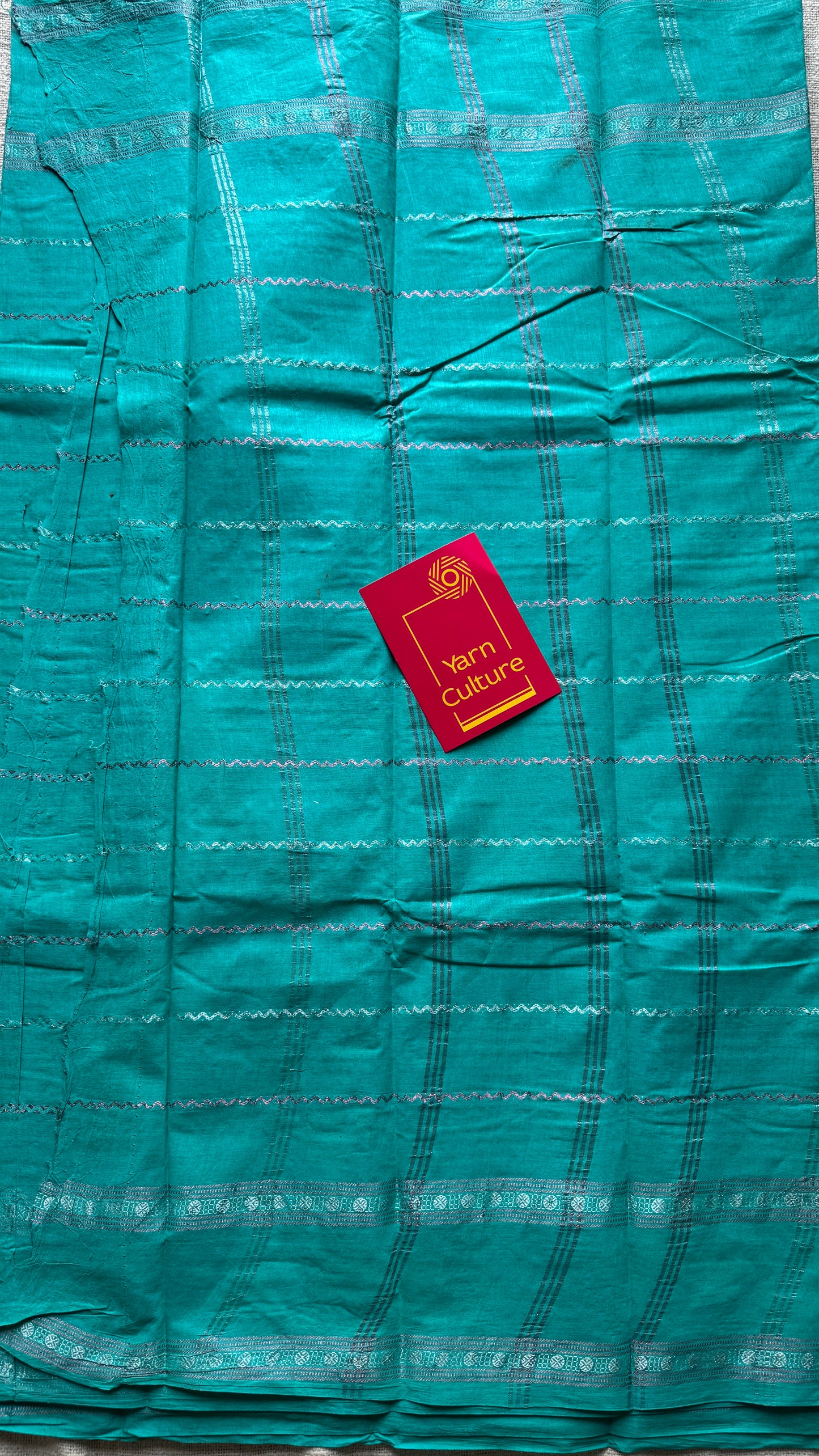 Turquoise veldhaari and patterned silver zari sungudi