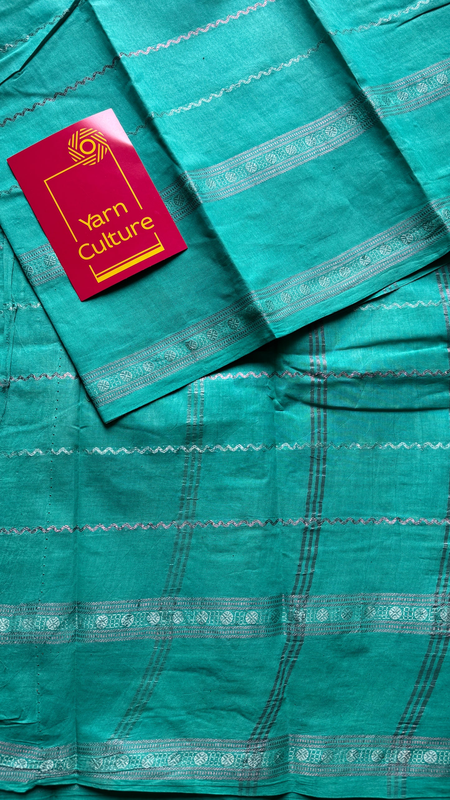 Turquoise veldhaari and patterned silver zari sungudi